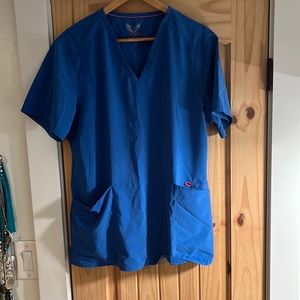 Smitten XL blue scrub top with some pink accent stitching.